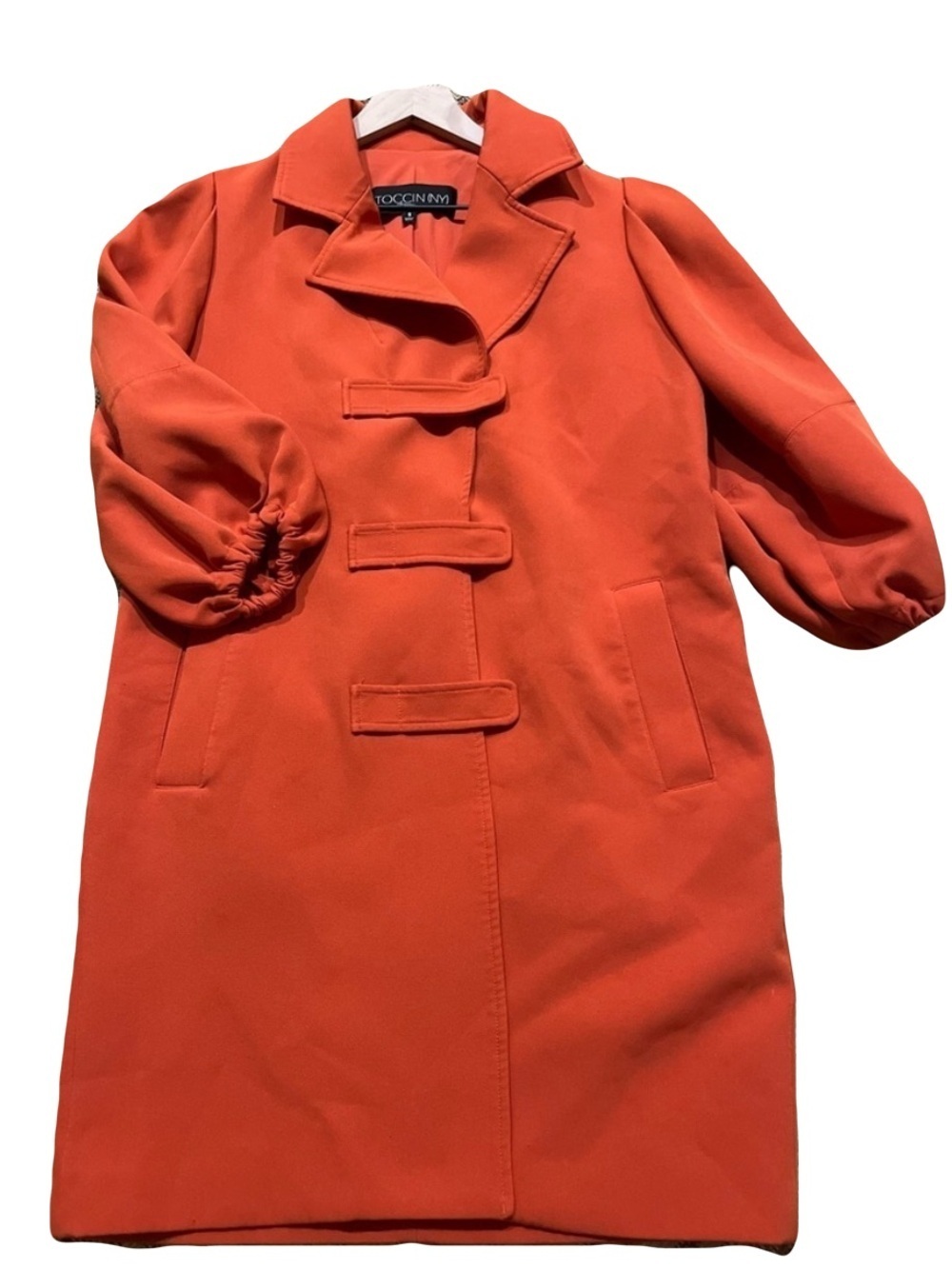 Toccin Statement Orange Coat with Sculptural Puff Sleeve Silhouette